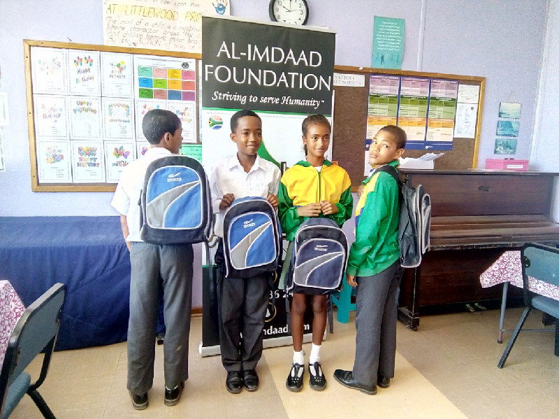 Students show off their new school bags at Littlewoods Primary in Eastridge